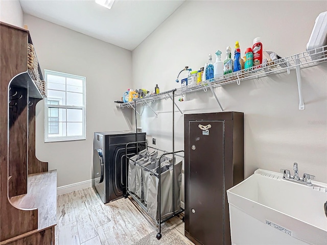 13028 Homestead Ln, Parrish, FL 34219 - laundry room with light wood-type flooring and baseboards