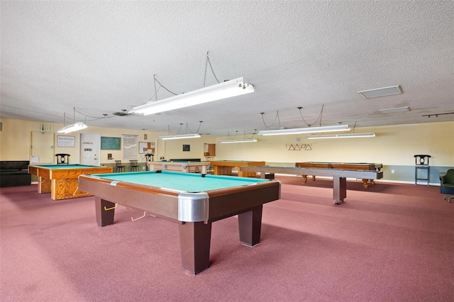 rec room with carpet flooring, a textured ceiling, and pool table