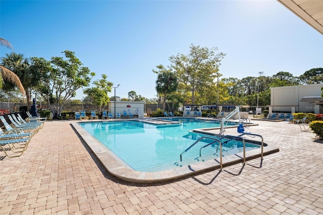 view of swimming pool featuring a patio area