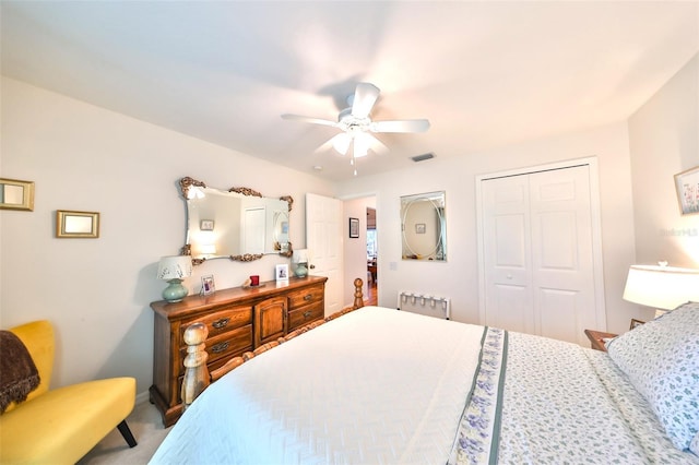 bedroom featuring visible vents, a closet, and ceiling fan