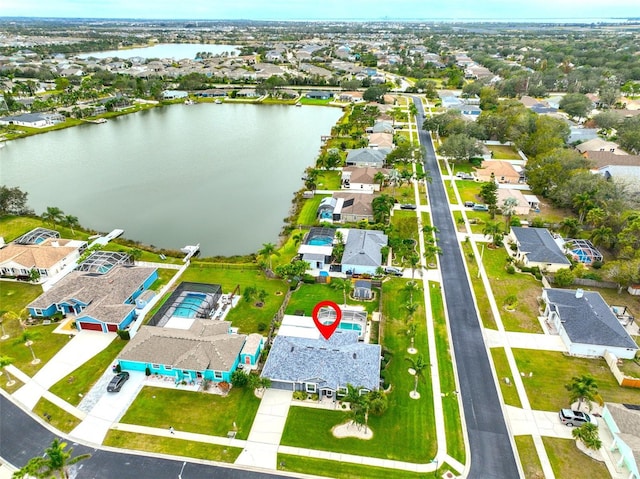 bird's eye view featuring a residential view and a water view