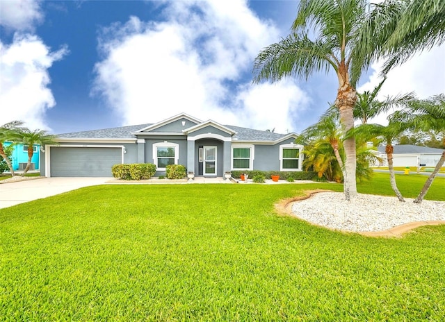 ranch-style home with a shingled roof, a front yard, stucco siding, driveway, and an attached garage