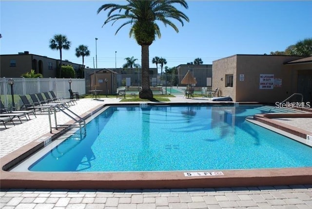 view of swimming pool with a patio area