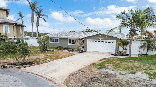 single story home featuring a garage