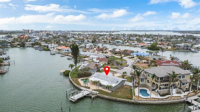 birds eye view of property with a residential view and a water view