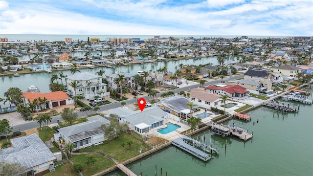 drone / aerial view with a water view