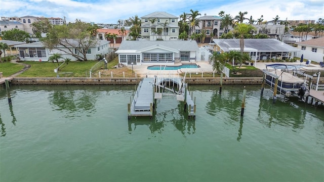 dock area with a yard and a water view