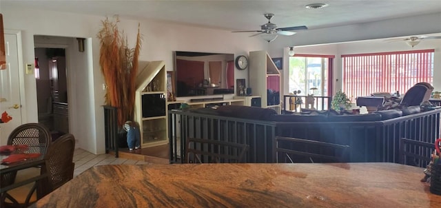 living room with light wood-type flooring and ceiling fan