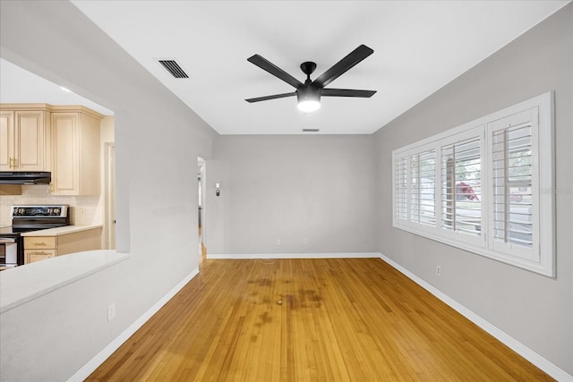 interior space with light wood-type flooring and ceiling fan