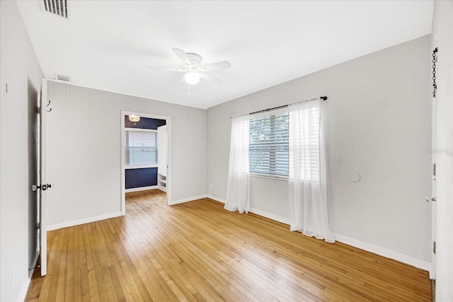 unfurnished room with hardwood / wood-style floors and ceiling fan