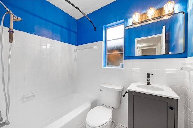 full bathroom featuring vanity, toilet, tile walls, and tub / shower combination