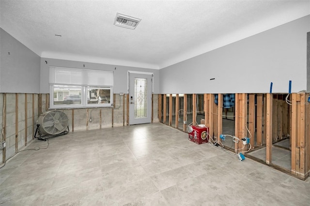 interior space with a textured ceiling