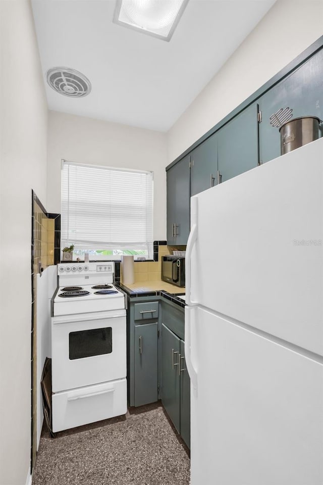 kitchen featuring tasteful backsplash and white appliances