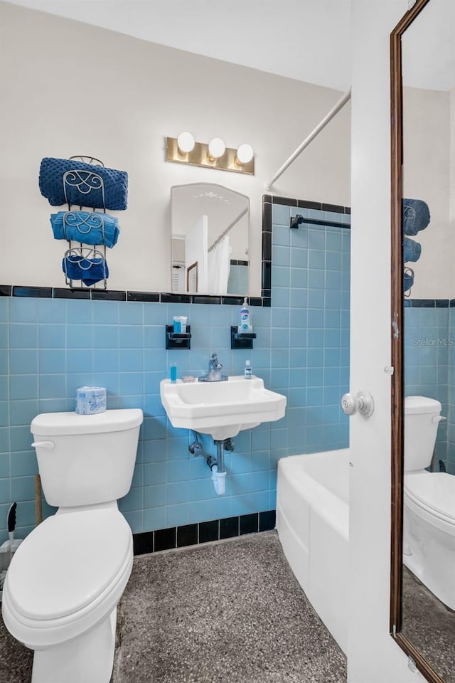 bathroom featuring toilet, tile walls, and shower / bath combination with curtain