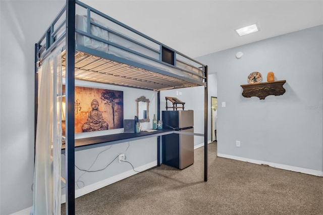 kitchen featuring stainless steel refrigerator and carpet flooring