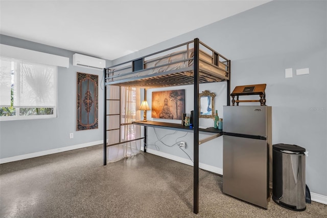 bedroom featuring stainless steel fridge and a wall mounted air conditioner