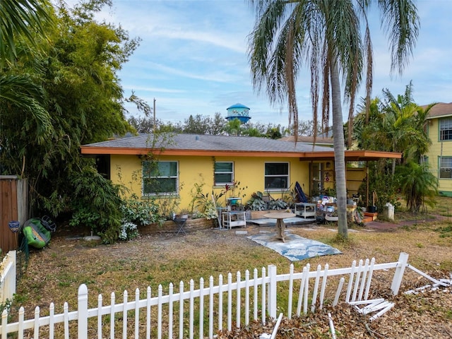 back of property with a patio area