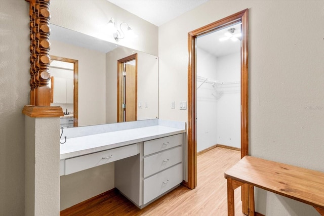 bathroom with vanity and wood-type flooring