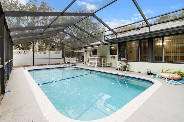 view of pool featuring a lanai and a patio