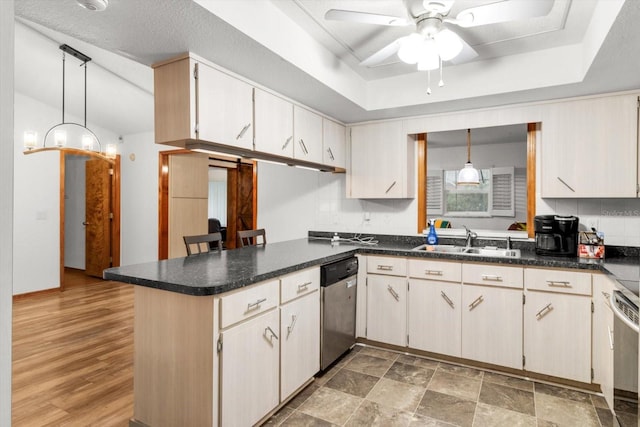 kitchen featuring dishwasher, ceiling fan, kitchen peninsula, and sink