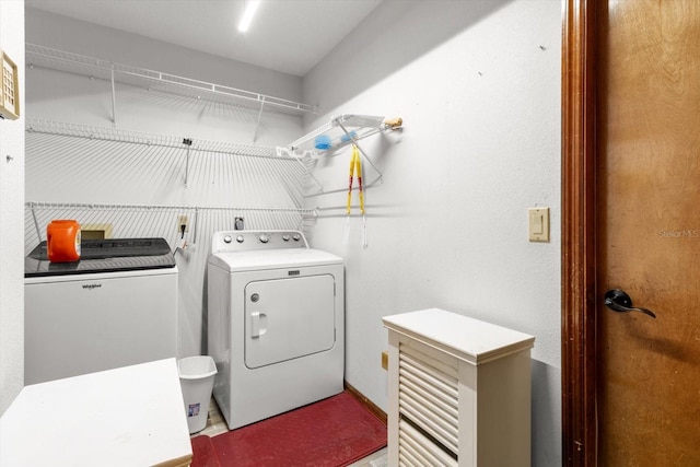 clothes washing area with independent washer and dryer