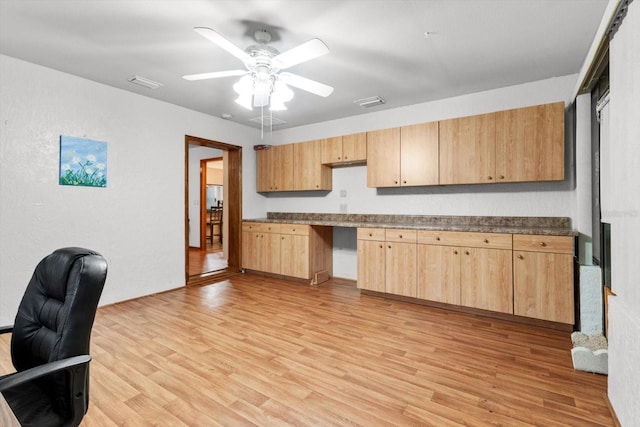 kitchen with ceiling fan, light brown cabinetry, and light hardwood / wood-style flooring