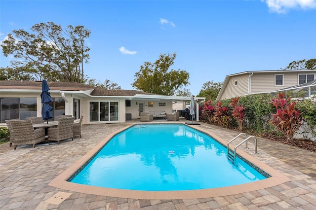 view of swimming pool with a patio area