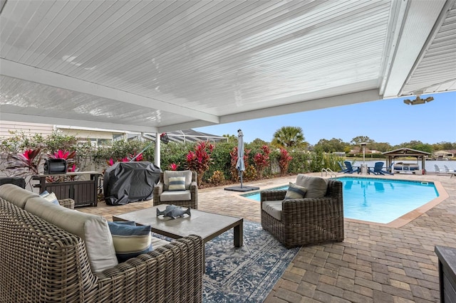 view of patio / terrace with a gazebo, a grill, and an outdoor living space