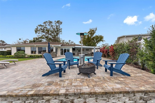 view of patio with a fire pit