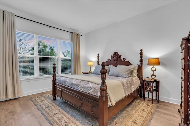 bedroom with light hardwood / wood-style flooring