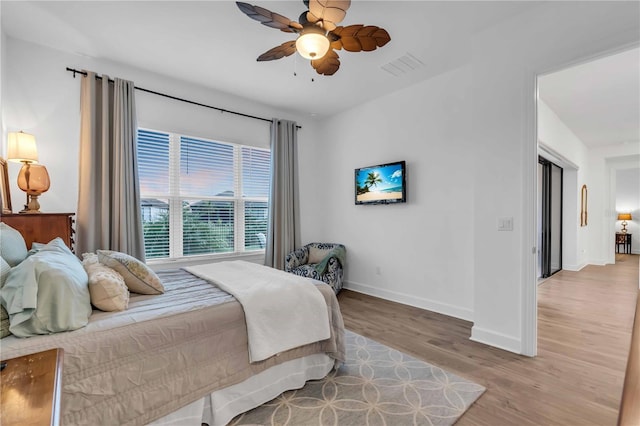 bedroom featuring light wood-type flooring and ceiling fan