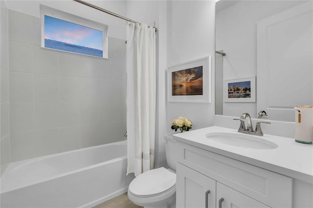 full bathroom featuring vanity, toilet, and shower / bath combo