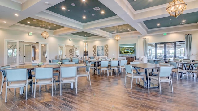 dining area with a notable chandelier, coffered ceiling, beamed ceiling, and crown molding