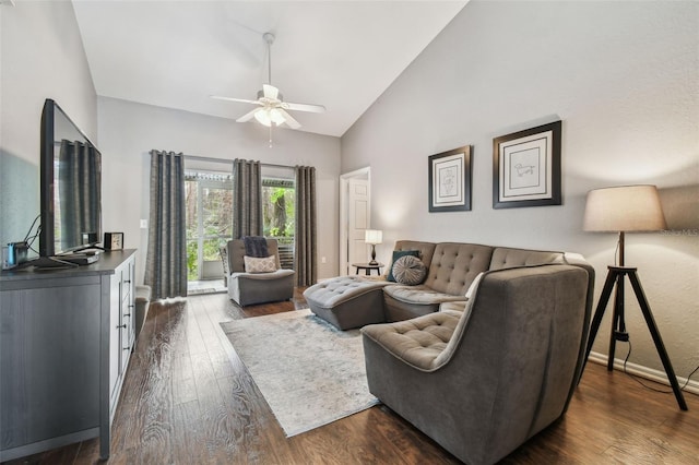 living room featuring dark wood-type flooring, ceiling fan, and high vaulted ceiling