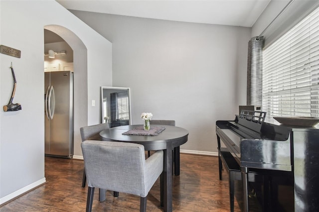 dining area with dark hardwood / wood-style flooring