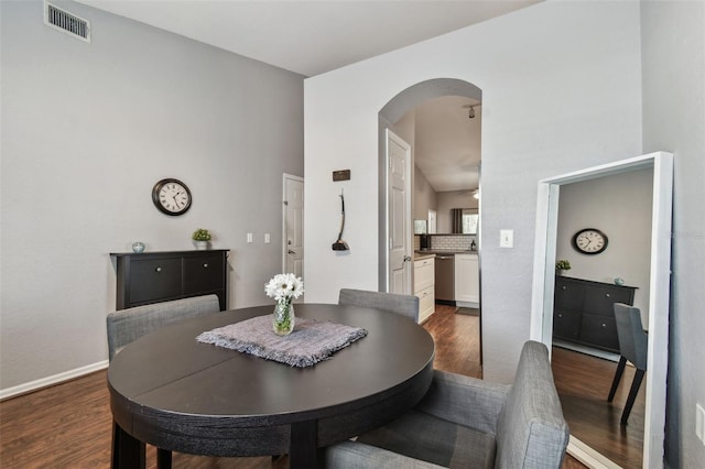 dining room with dark hardwood / wood-style flooring