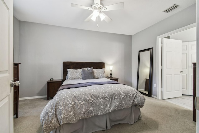 bedroom with light colored carpet and ceiling fan