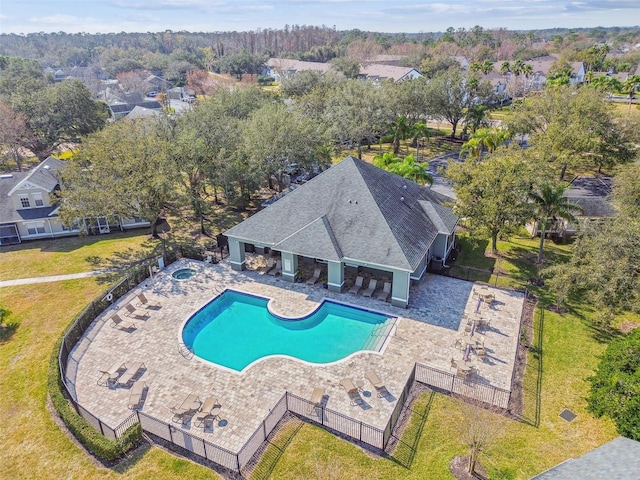 view of swimming pool featuring a patio, a yard, and an in ground hot tub