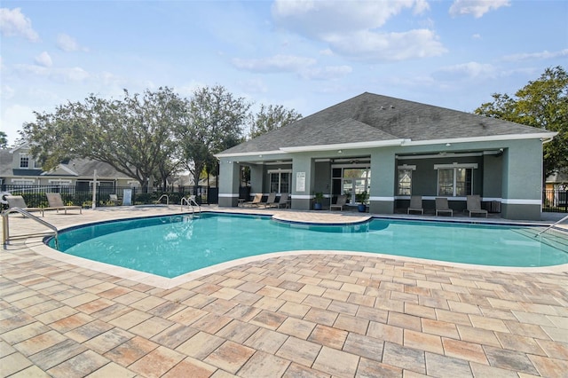 view of pool with ceiling fan and a patio area