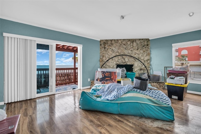 bedroom featuring access to exterior and hardwood / wood-style flooring