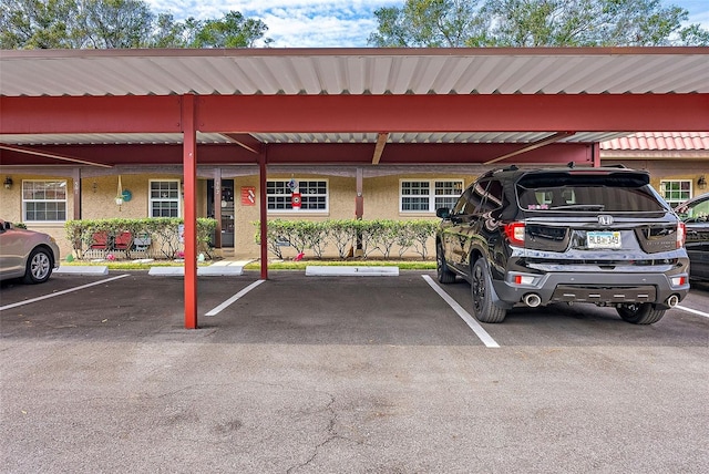 view of parking / parking lot with a carport