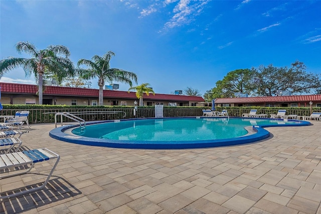 view of swimming pool featuring a patio