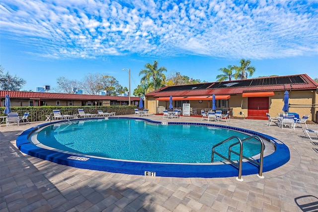 view of pool featuring a patio area