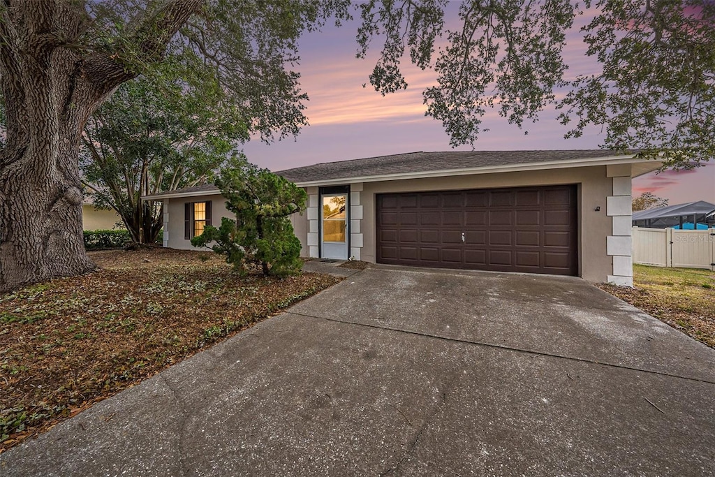 ranch-style house featuring a garage