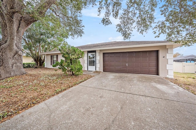 ranch-style house featuring a garage