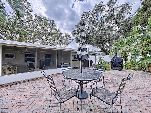 view of patio with a sunroom and area for grilling