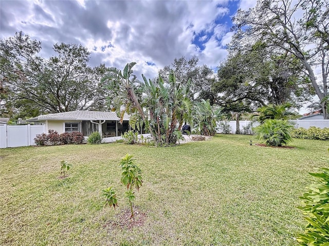 view of yard with a sunroom