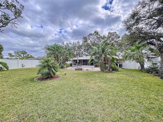 view of yard with a sunroom