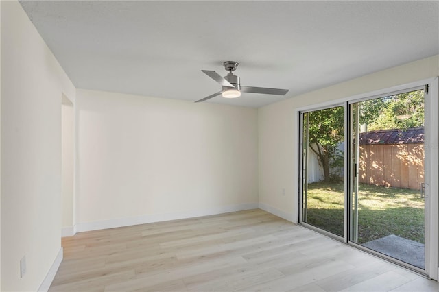 unfurnished room featuring ceiling fan and light wood-type flooring