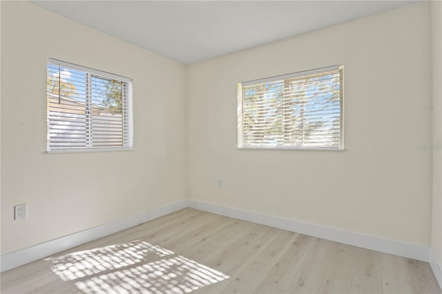 empty room with light wood-type flooring